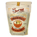 Bob's Red Mill Muesli cereal in a bowl with mixed grains, nuts, and dried fruit, ready for breakfast.