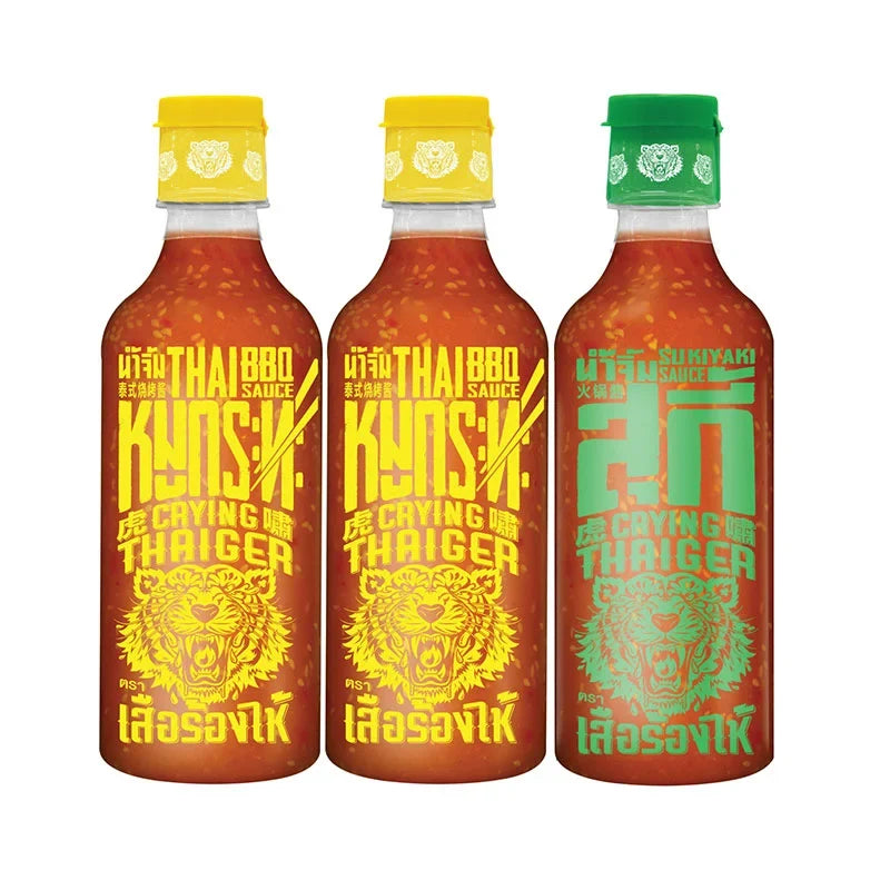 CRYING THAIGER Crying Thaiger BBQ Sauce Suki 490g, two bottles, dry grocery product with dark, flavorful sauce in glass bottles