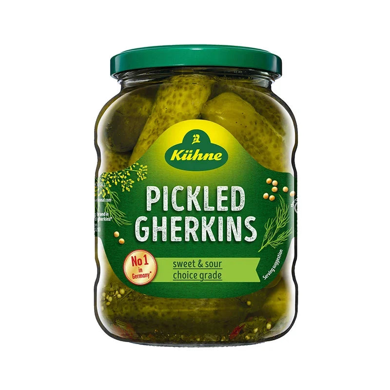 Jar of Kuhne Pickled Gherkins in 670g jar, showing fresh, crunchy pickles with label visible on the dry grocery product.
