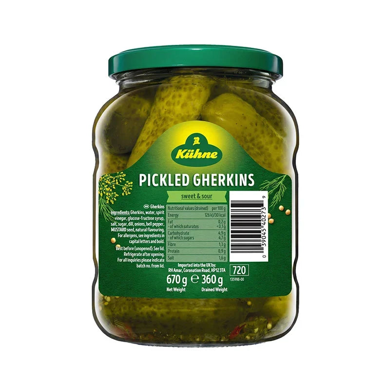 Jar of Kuhne Pickled Gherkins in a clear glass jar with a label, showing green pickled gherkins inside