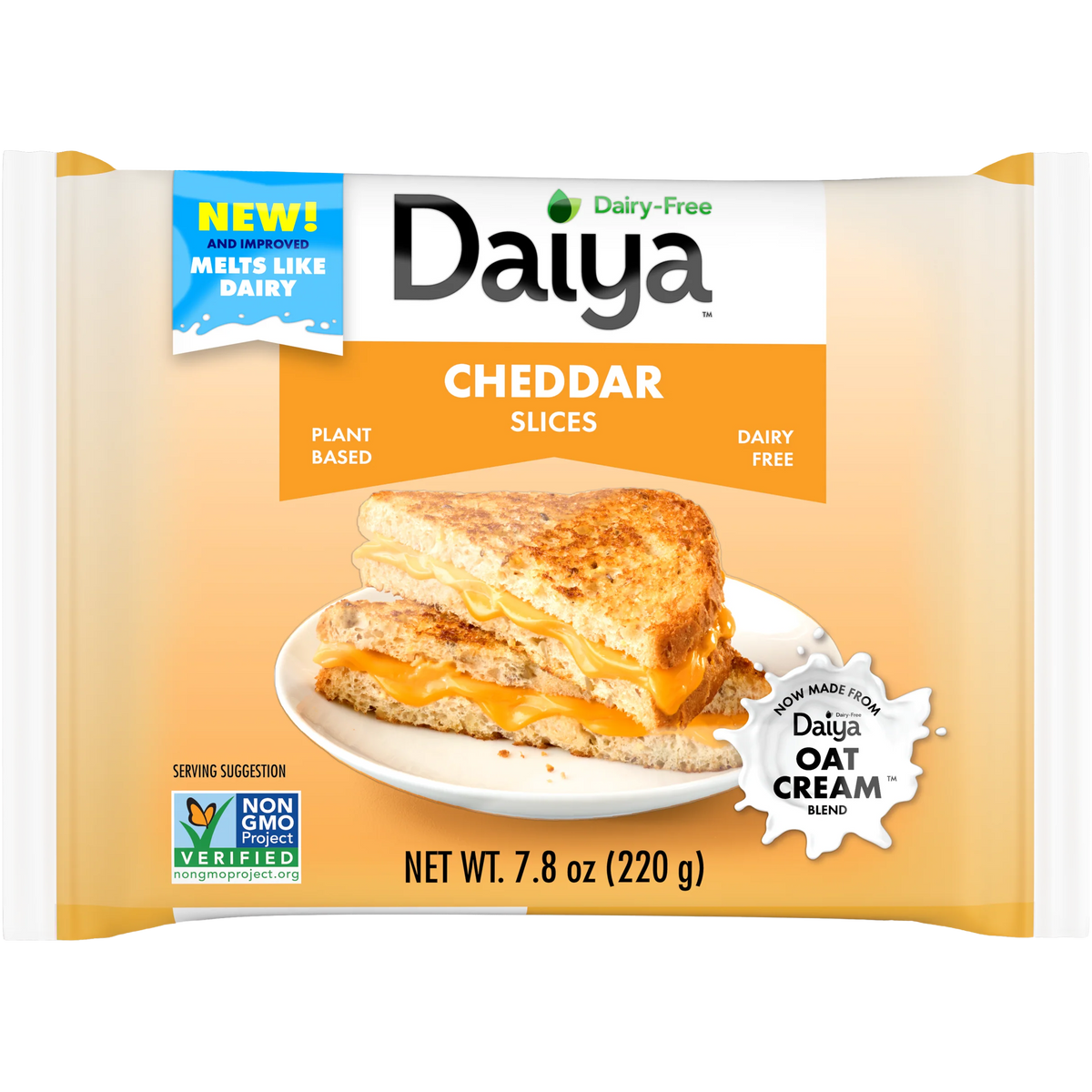 Sliced Daiya Vegan Cheddar Cheese on a plate, showcasing its vibrant orange color and smooth texture.