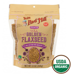 Golden organic flaxseeds in a clear container, showcasing Bob's Red Mill brand on a white background for healthy grocery shopping.