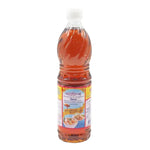 Bottle of Tiparos Fish Sauce 700ml for cooking, with clear label showing the Tiparos brand and fish sauce content in a kitchen setting.