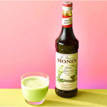 Bottle of MONIN Matcha Green Tea Syrup 700ml for dry grocery, with green tea flavor and vibrant green label.