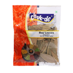 Dried Chuk-De Bay Leaves in a clear container, used for cooking and flavoring in culinary dishes.