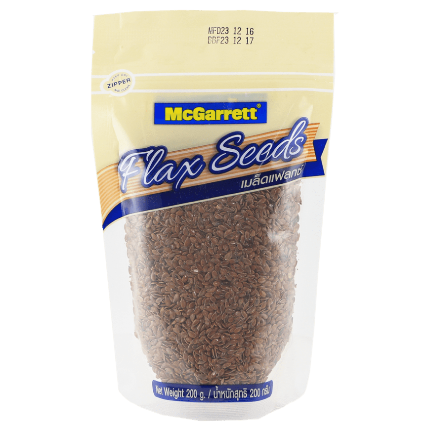 Close-up of McGarrett Flax Seed in a clear glass jar, showcasing small, golden flax seeds for healthy cooking and baking.