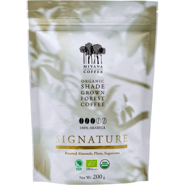 Organic Mivana roasted coffee beans labeled Signature, shown in a close-up image highlighting the rich, dark coffee beans.