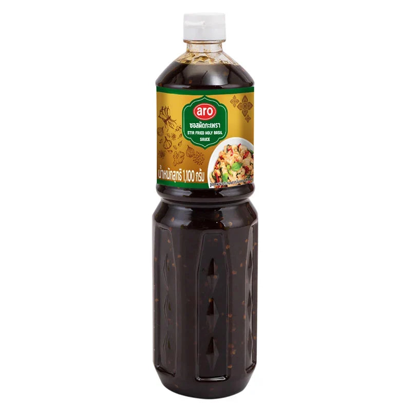 A jar of ARO Stir Fried Holy Basil Sauce in 1.1kg size, showing the label and product packaging for dry grocery use.
