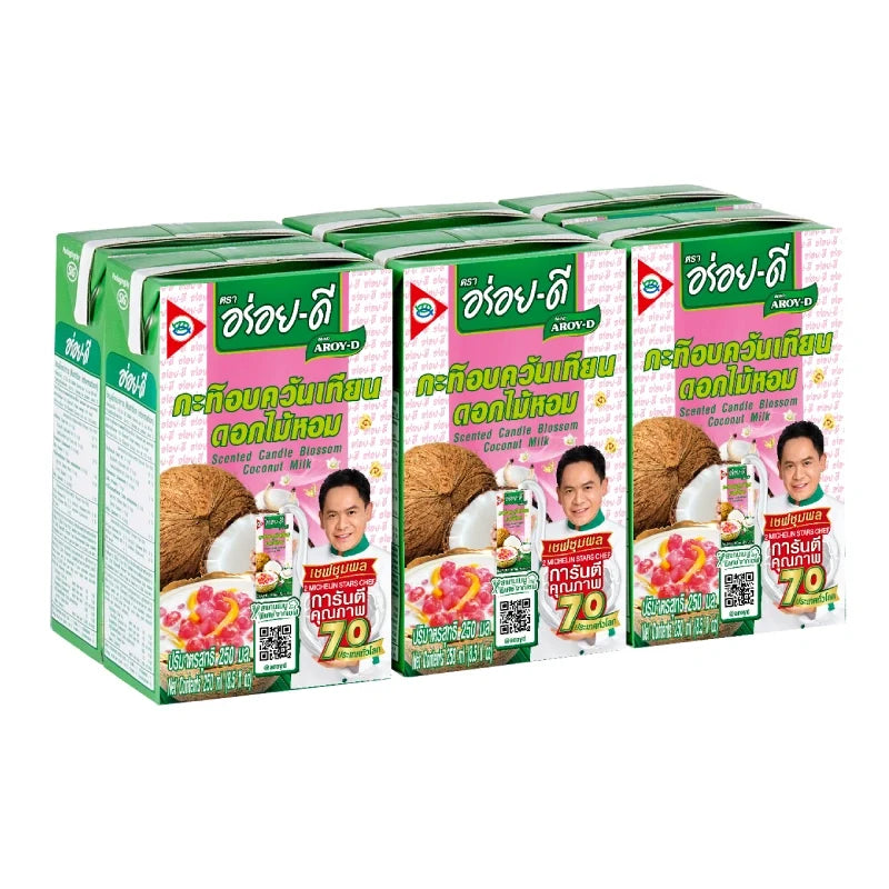 Aroy-D Coconut Fragrant 250ml bottles displayed, part of a pack of six, in a dry grocery setting.