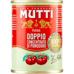 Cans of Mutti double concentrated tomato paste stacked in a grocery aisle, showing bright red tomato product branding.