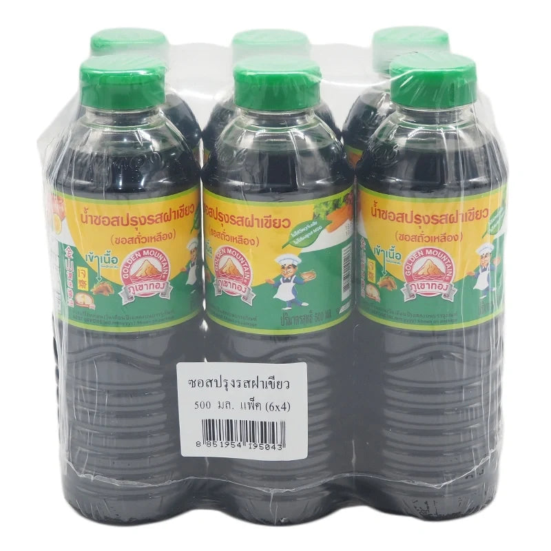Golden Mountain Seasoning Sauce with green cap, 500ml bottle, showing the label and bottle design in a dry grocery setting.