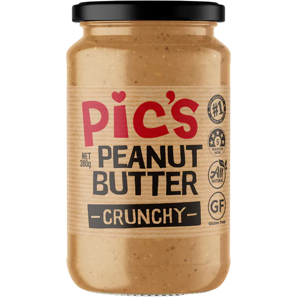 Crunchy Pic's Peanut Butter jar with a label, showing the creamy texture and natural peanut ingredients in a grocery setting.