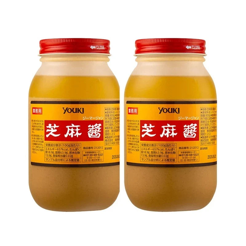 Two bottles of YOUKI Jima Jang White Roasted Sesame Paste, 800g each, in clear bottles showing the creamy sesame paste inside.