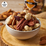 Farmer's Grain mixed nuts, a variety of confectionery snack with almonds, cashews, and walnuts in a colorful bowl.
