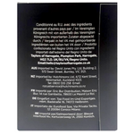 Taylors Pure Peppermint drink in a clear glass bottle with a green label and fresh peppermint leaves beside it.