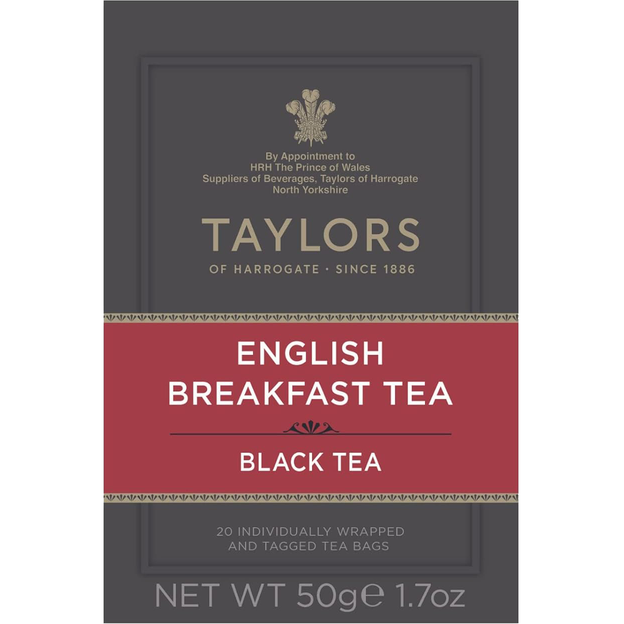 A cup of brewed Taylors English Breakfast Tea in a white mug on a wooden table, showcasing the rich amber color of the drink.
