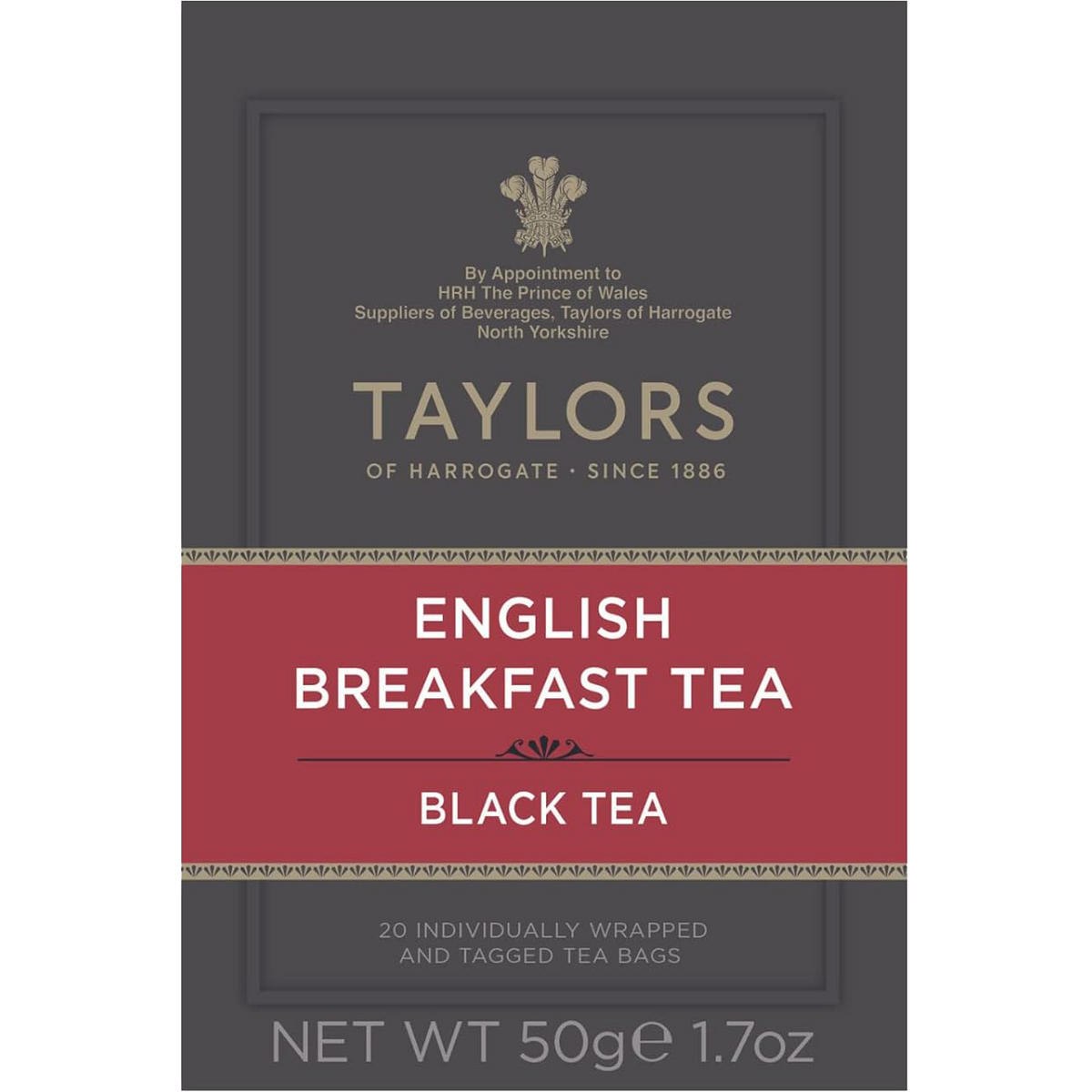 A cup of brewed Taylors English Breakfast Tea in a white mug on a wooden table, showcasing the rich amber color of the drink.