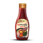 Gogo Gochujang Sauce bottle, a spicy Korean chili paste used in cooking and dipping, with red sauce visible inside the bottle.
