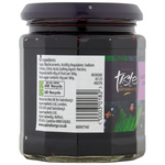 Jar of Sainsbury's Taste The Difference blackcurrant conserve with fresh blackcurrants visible inside the glass jar.