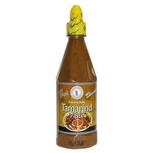 Thai Dancer Tamarind Paste in a jar, natural grocery product for cooking, with a label showing Thai Dancer brand and tamarind images.