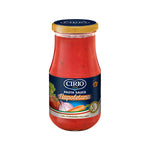 Jar of Cirio Pasta Sauce Napoletana with fresh herbs and tomatoes, showing the vibrant, red tomato-based sauce inside.