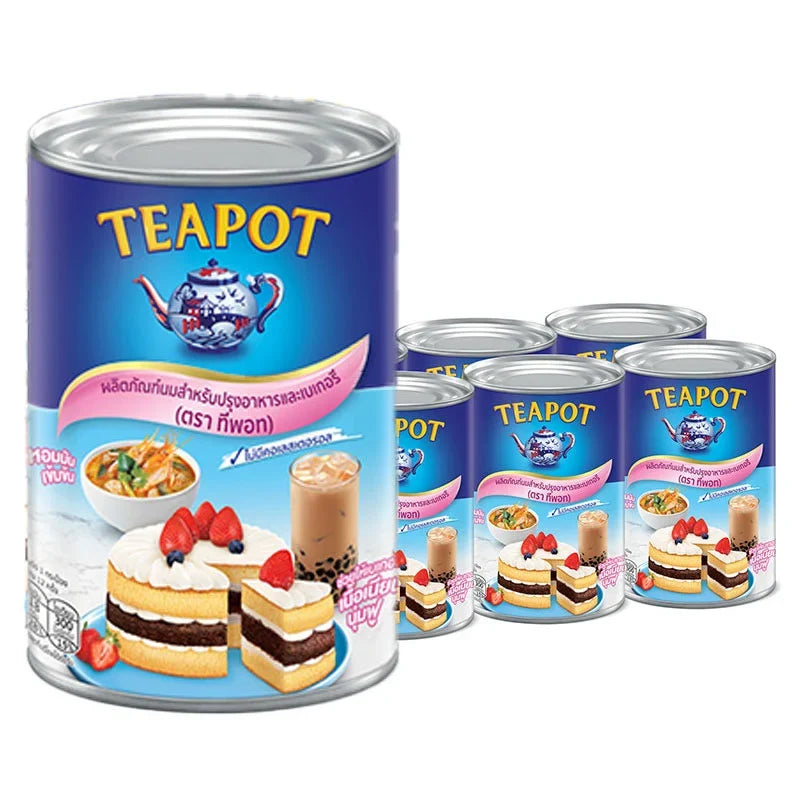 Teapot Milk Powder in a 385g container, shown stacked in a pack of six, for dry grocery use by TEAPOT brand.