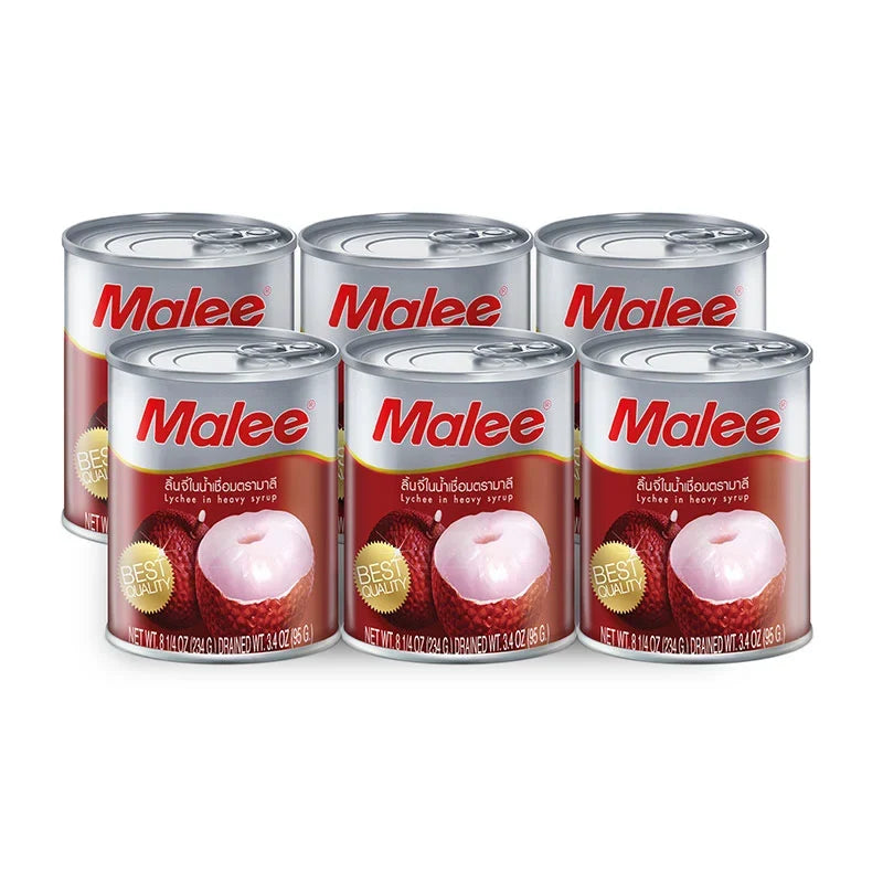 Cans of Malee Lychee in heavy syrup, 8.25 oz, arranged on a shelf, showcasing the fruit in syrup from the Malee dry grocery brand.