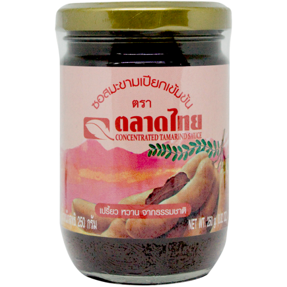 Talad Thai Tamarind Sauce bottle, a grocery product with a dark amber liquid, used for cooking and flavoring Asian dishes.