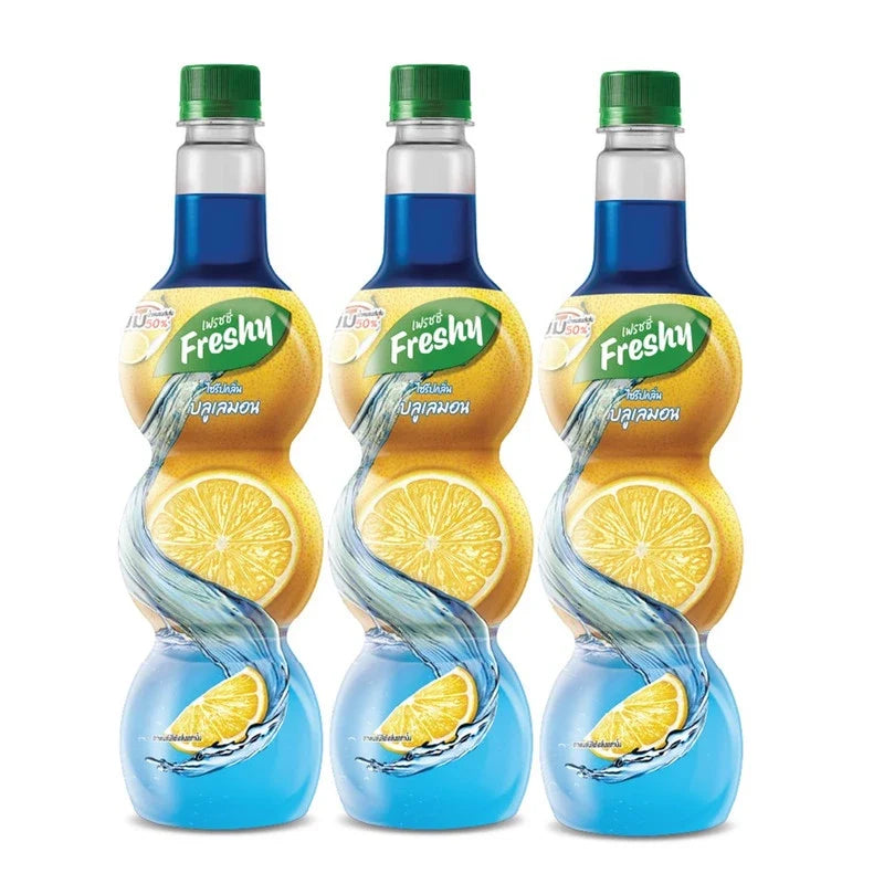 Freshy Blue Lemon Flavored Syrup 710ml, shown in a clear bottle with blue lemon label, ideal for beverages and desserts.