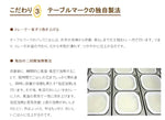 Cooked Koshihikari Japanese rice by TABLEMARK, featuring Uonuma water, displayed in a bowl with rice grains visible.