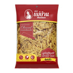 Dried Maeban bamboo shoots in Yanang leaves, packaged for dry grocery use, with fresh bamboo shoots and green Yanang leaves visible.
