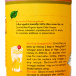 Bottle of Happy Mate Raw Organic Apple Cider Vinegar with a label, standing on a wooden surface.