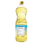 Yok Extra 100% Canola Oil in a 1-liter bottle, displayed with two bottles for cooking and baking use.