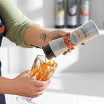 Bottle of MONIN caramel sauce in 500ml size, ideal for desserts and beverages, with a rich, golden caramel color.