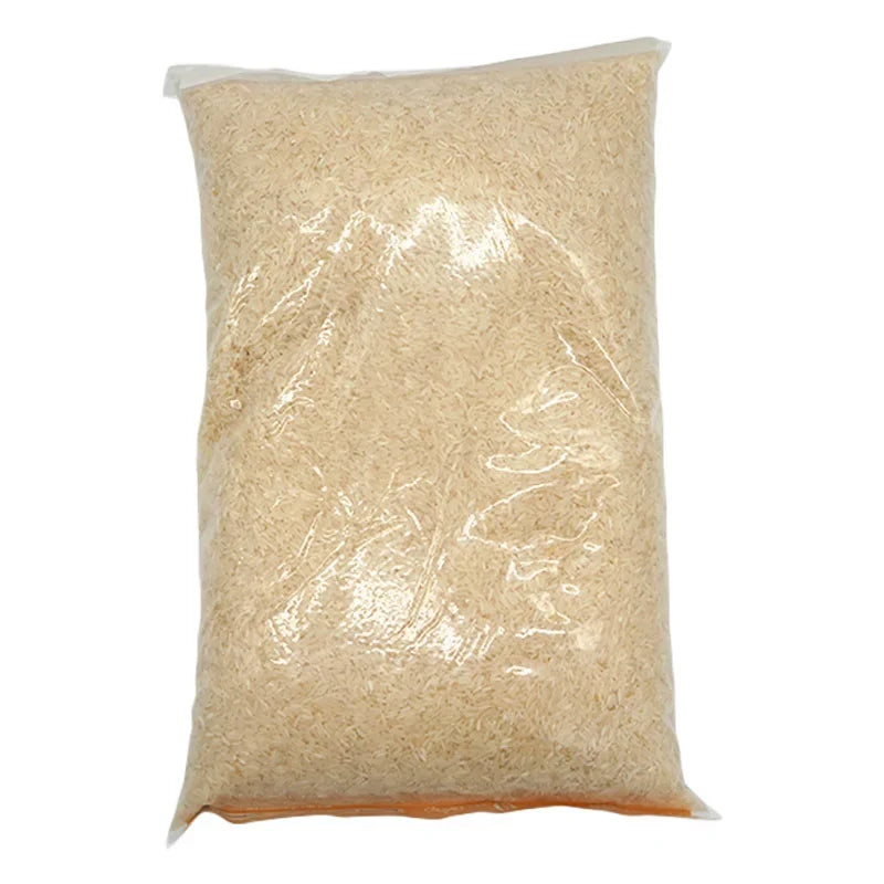 Panomrung Jasmine Rice 100% dry grocery 5kg bag, showing the white rice grains in a clear image.
