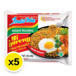 Indo Mie Mi Goreng fried noodles in 85g packs, dry grocery product, showcasing cooked noodles with seasoning and garnishes.