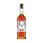 Giffard Mixology Peach 1L bottle of peach-flavored syrup for cocktails and beverages, displayed in a clear bottle with label.