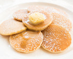 Healthy Yes You Can Butter Milk Pancake mix in a box, featuring a stack of pancakes with butter and syrup on a plate.