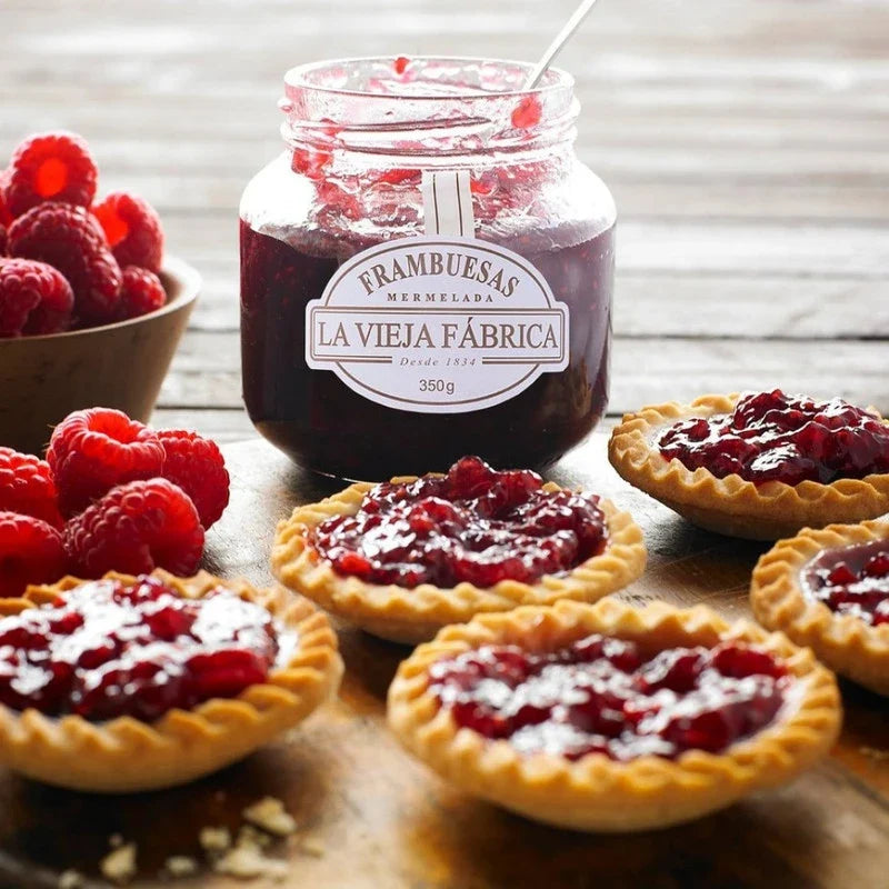 Jar of LA Vieja Fabrica Raspberry Mermelada 350g, a sweet fruit jam in a glass jar with raspberry pieces visible inside.