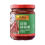 Bottle of Lee Kum Kee Chilli Garlic Sauce with red chili peppers and garlic cloves on the label, for use in Asian cooking.