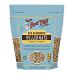 A bowl of Bob's Red Mill whole grain rolled oats, showcasing the healthy, natural oat flakes in a clear glass bowl.