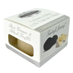 Creamy Tartufi Jimmy Brie with black truffle in a jar, showcasing smooth texture and black truffle pieces visible inside.