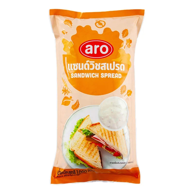 A 1kg jar of ARO Sandwich Spread in a clear plastic container, ready for use in sandwiches and snacks.