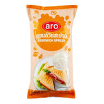 A 1kg jar of ARO Sandwich Spread in a clear plastic container, ready for use in sandwiches and snacks.