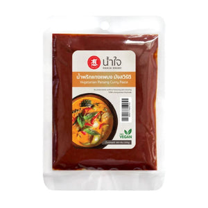 Namjai Panang Curry Paste 100g jar, dry grocery product with vibrant label and lid, ideal for Thai-style curry cooking.