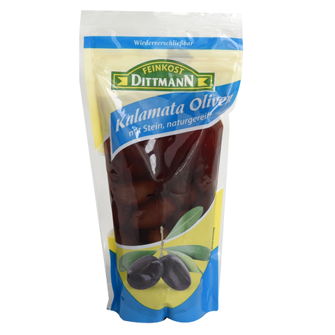 Bowl of Feinkost Dittmann Kalamata olives in brine, showcasing dark purple olives with a shiny, smooth texture.