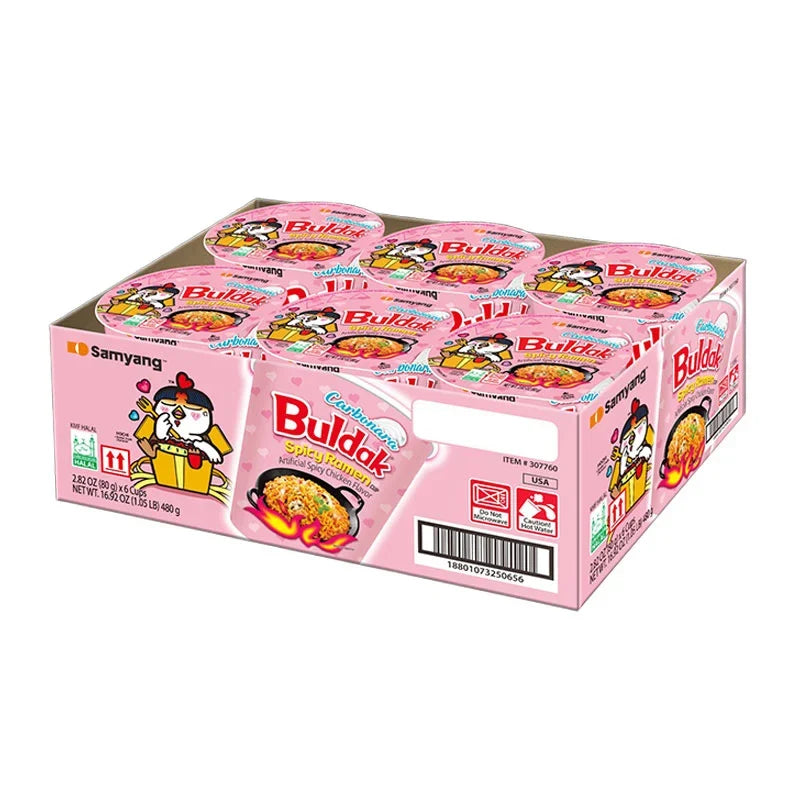 Samyang Buldak Cup Ramen Carbonara 80g x6, dry grocery product with packaged instant ramen cups featuring creamy carbonara flavor.