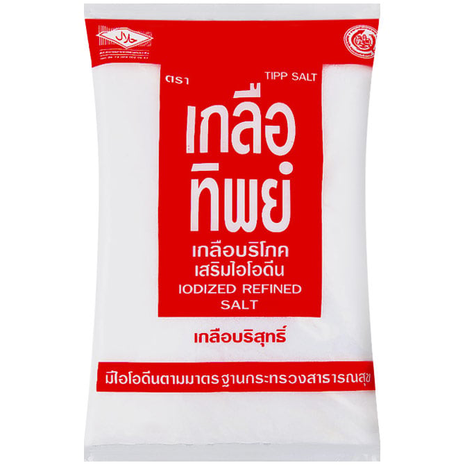 Tip Salt grocery product in a clear container, showing white granulated salt with a Tip brand label.