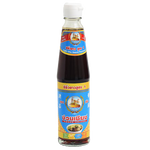 Nguan Chiang White Soy Sauce bottle from the grocery aisle, featuring a clear label and dark soy sauce inside.