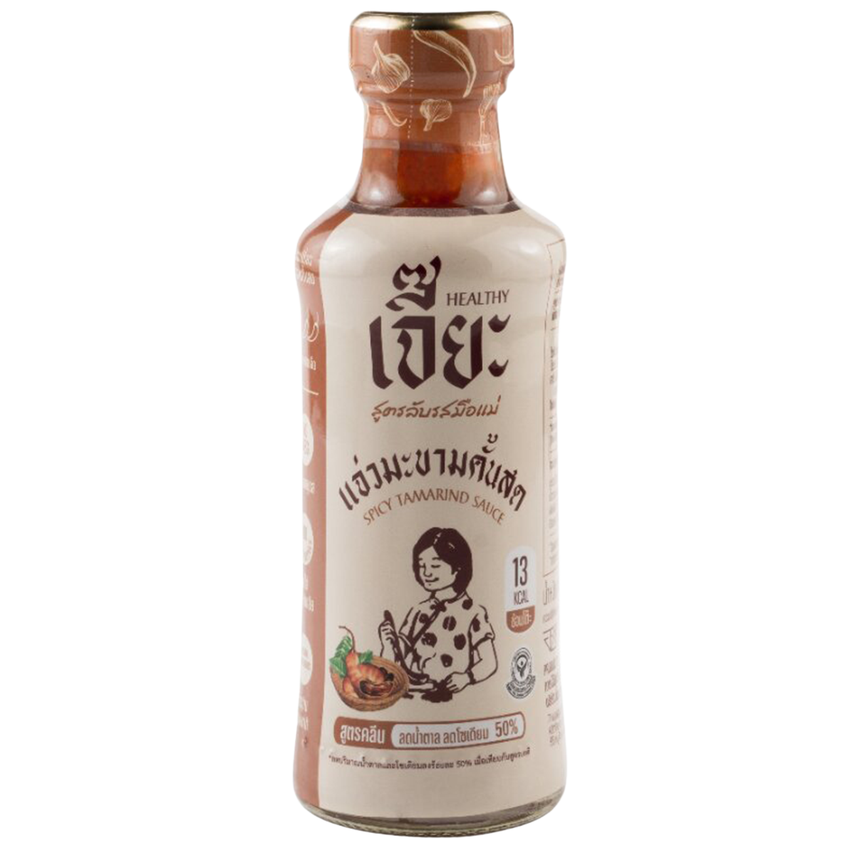 Jar of Jea Spicy Tamarind Sauce in a grocery setting, displaying the label and rich, dark sauce inside the jar.